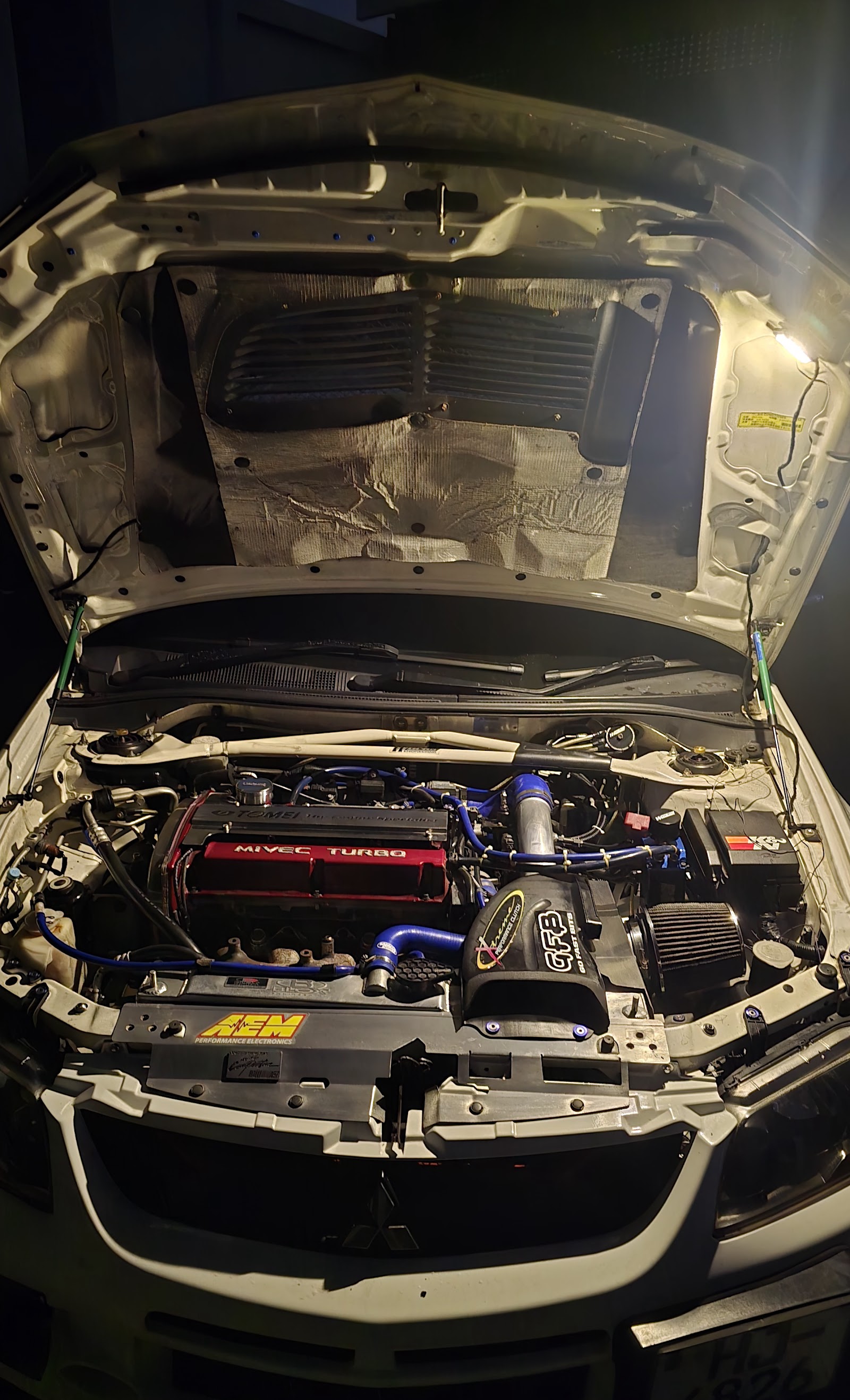 Detailed engine bay service work at Auto Medic